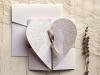 cod - 39850
Invitatie de nunta din carton alb
reprezentand mirii pe o inima 
accesorizata cu panglica.
Plicul este alb
Pretul contine plic, TVA 
iar inscriptionarea este de 0,58 lei/buc
montajul este optional = 0,60 lei/buc 
